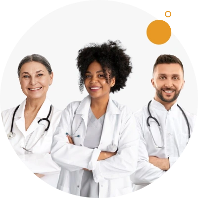 Three healthcare professionals, dressed in white, with their arms crossed and smiling